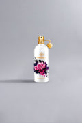 White perfume bottle with a gold cap and charm, featuring a vibrant pink rose design and branded with Montale, representing the luxury fragrance Roses Musk - Limited Edition White.