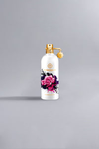 White perfume bottle with a gold cap and charm, featuring a vibrant pink rose design and branded with Montale, representing the luxury fragrance Roses Musk - Limited Edition White.