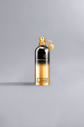 Luxury perfume bottle with a gradient gold and black finish, featuring the label So Amber Gold, elegant and high-end design for sophisticated fragrance lovers.
