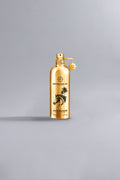 Arabians Gold luxury perfume bottle in reflective metallic gold with black horse and palm tree design, showcasing high-end fragrance elegance.