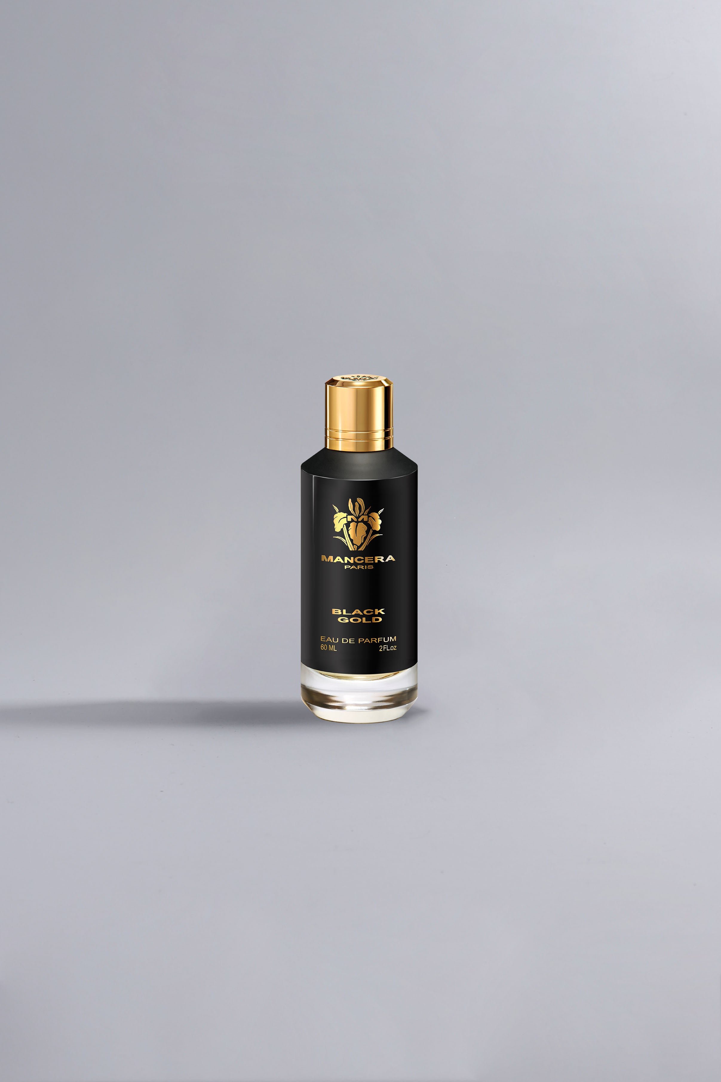 Black Gold Black luxury perfume bottle with black and gold design, standing alone on a minimalist gray background, showcasing elegant high-end fragrance packaging.