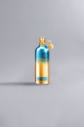 Luxury Montale perfume bottle with a blue and gold gradient design, labeled Day Dreams Green, standing on a light gray background.