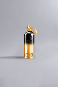Luxury perfume bottle with a gradient gold and black finish, featuring the label So Amber Gold, elegant and high-end design for sophisticated fragrance lovers.