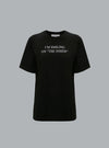 SLOGAN TEE IM SMILING ON THE INSIDE BLACK