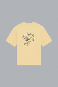 Yellow t-shirt with text and graphic on a gray background