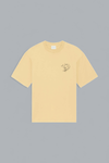Yellow t-shirt with a small graphic on a gray background