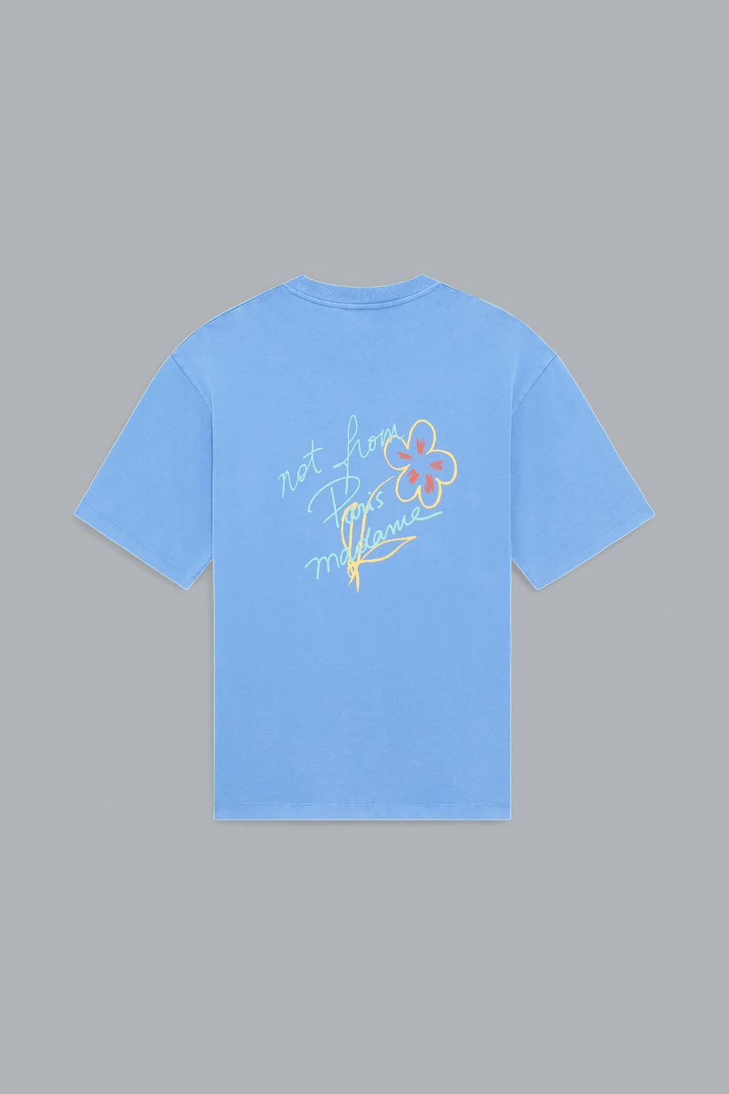 Light blue t-shirt with floral design and text on a gray background