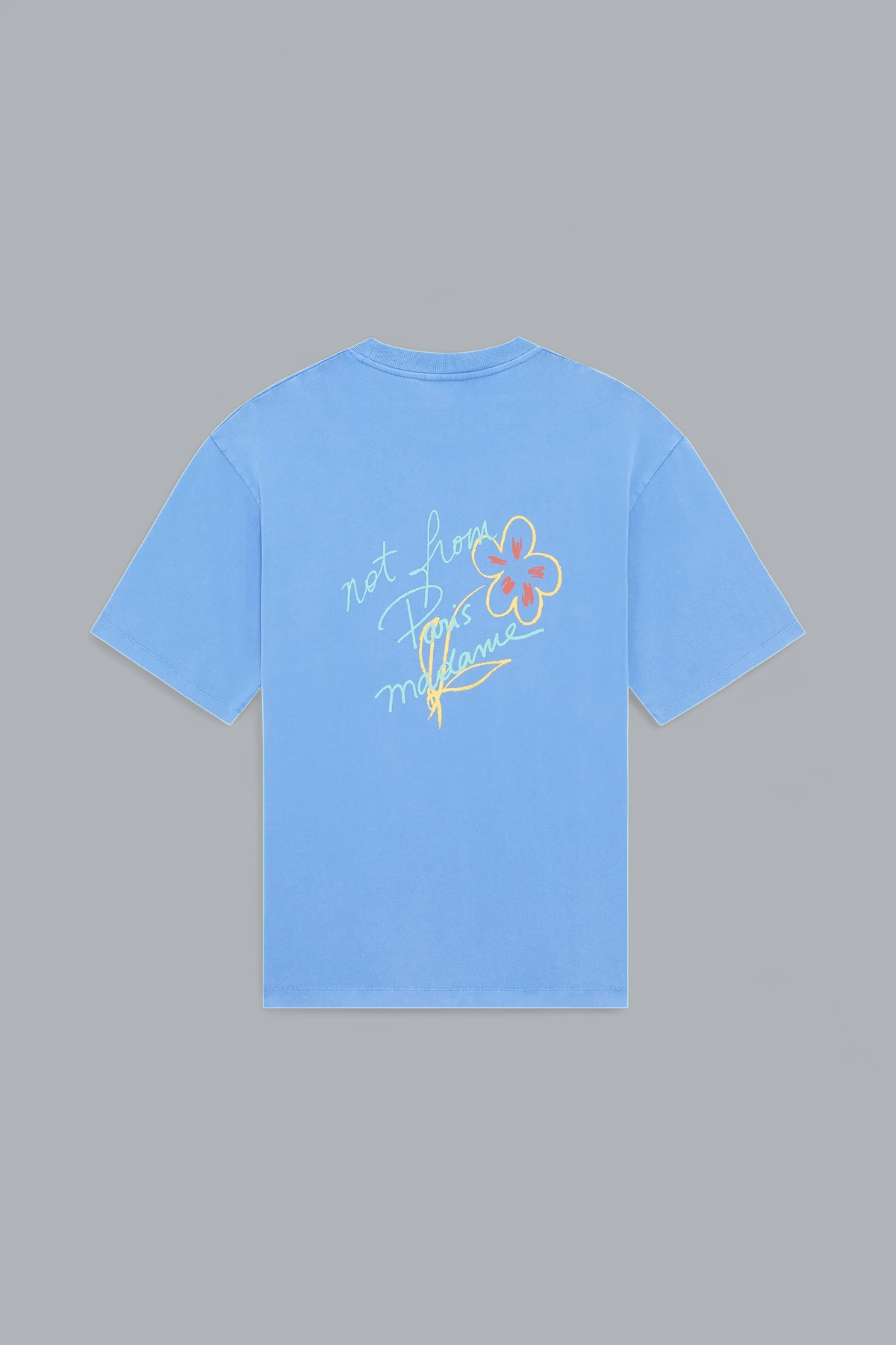 Light blue t-shirt with floral design and text on a gray background